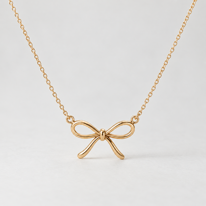 elvarinio Delicate Bow Necklace — studio design visualization [main]. AI-generated; product specifications pending verification.