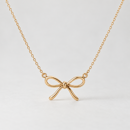 elvarinio Delicate Bow Necklace — studio design visualization [main]. AI-generated; product specifications pending verification.
