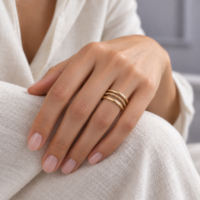 A considered stack of three slender rings